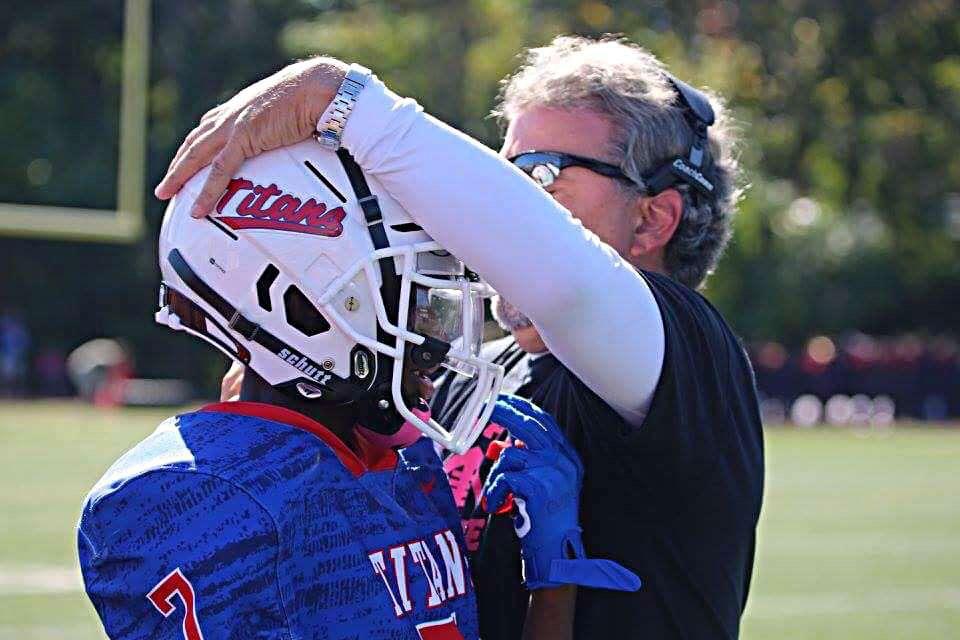 Coach Longerbeam giving his son Robert a pat on the helmet (Photo by Robert Longerbeam).