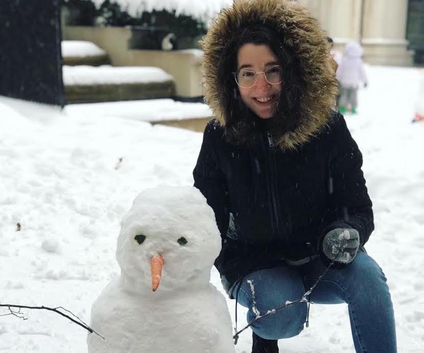 Taryn Edwards posing with a snowman on her day off