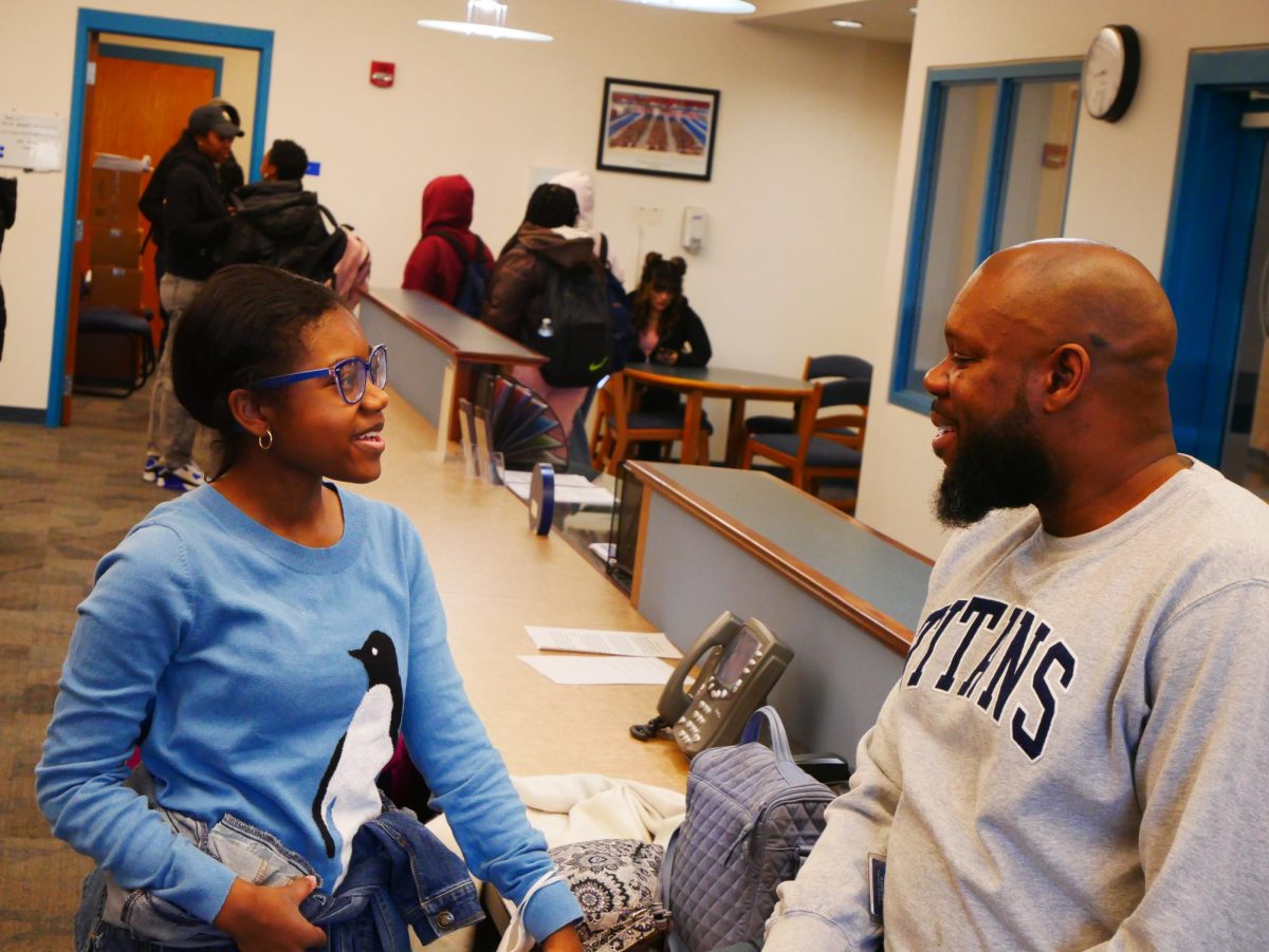 Carter Sinclair shares a smile with junior Ariana Singleton.