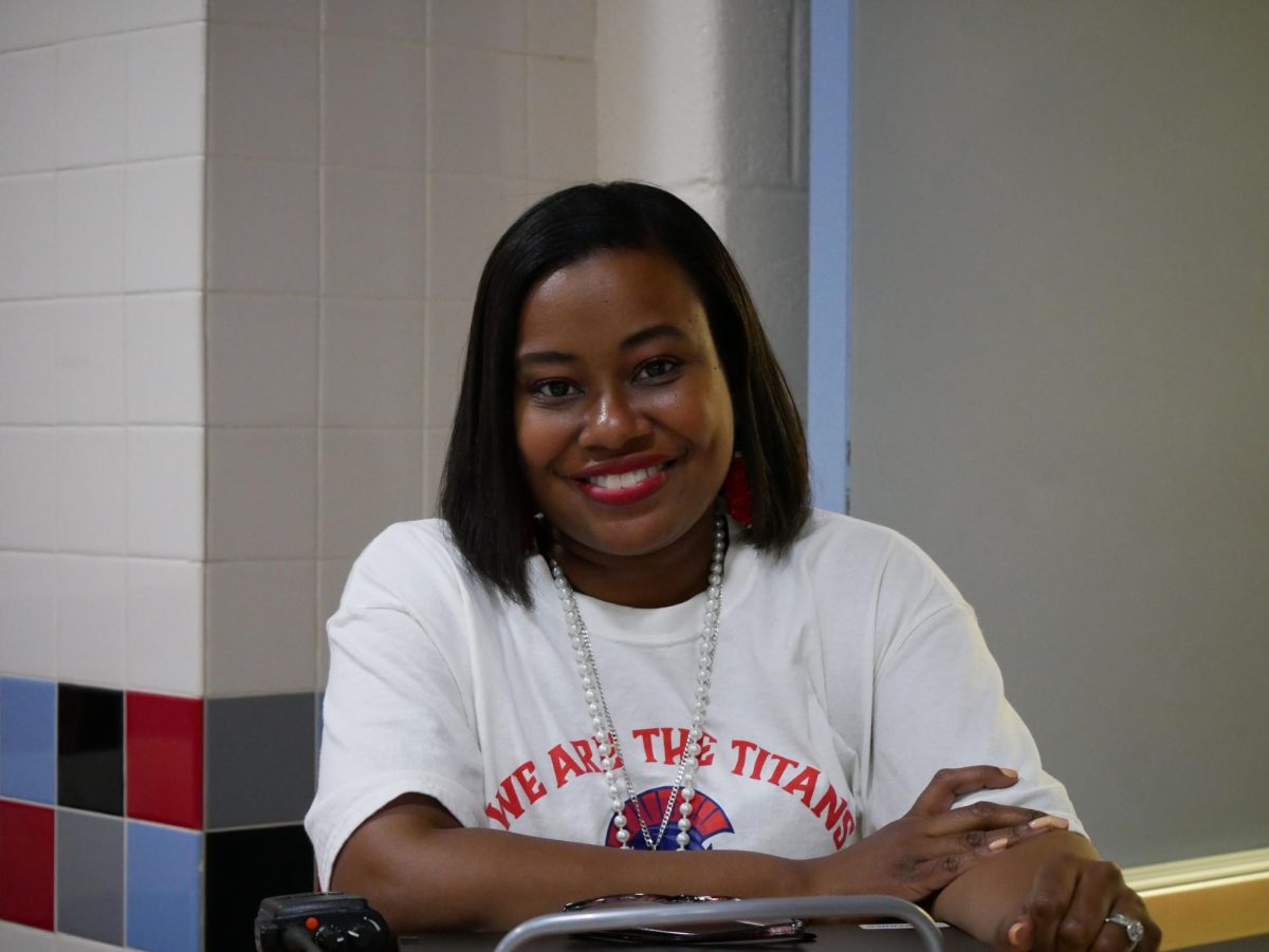 Tiffany Barner, a new Assistant principal, works in the cafeteria during lunch and offers help to students.
