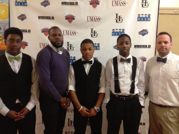 Carter Sinclair and three of his students as well as another staff member pose while dressed up with bow-ties.