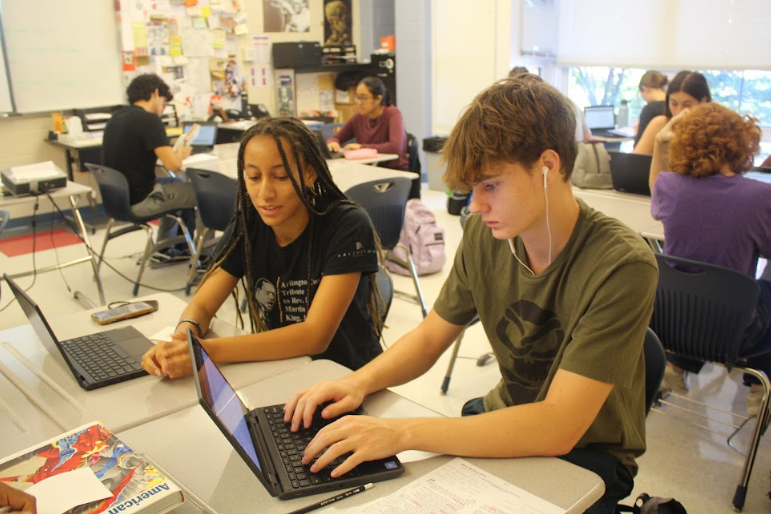 Yahney-Marie Sangaré tutoring Jack Karoly at the Writing Center.
