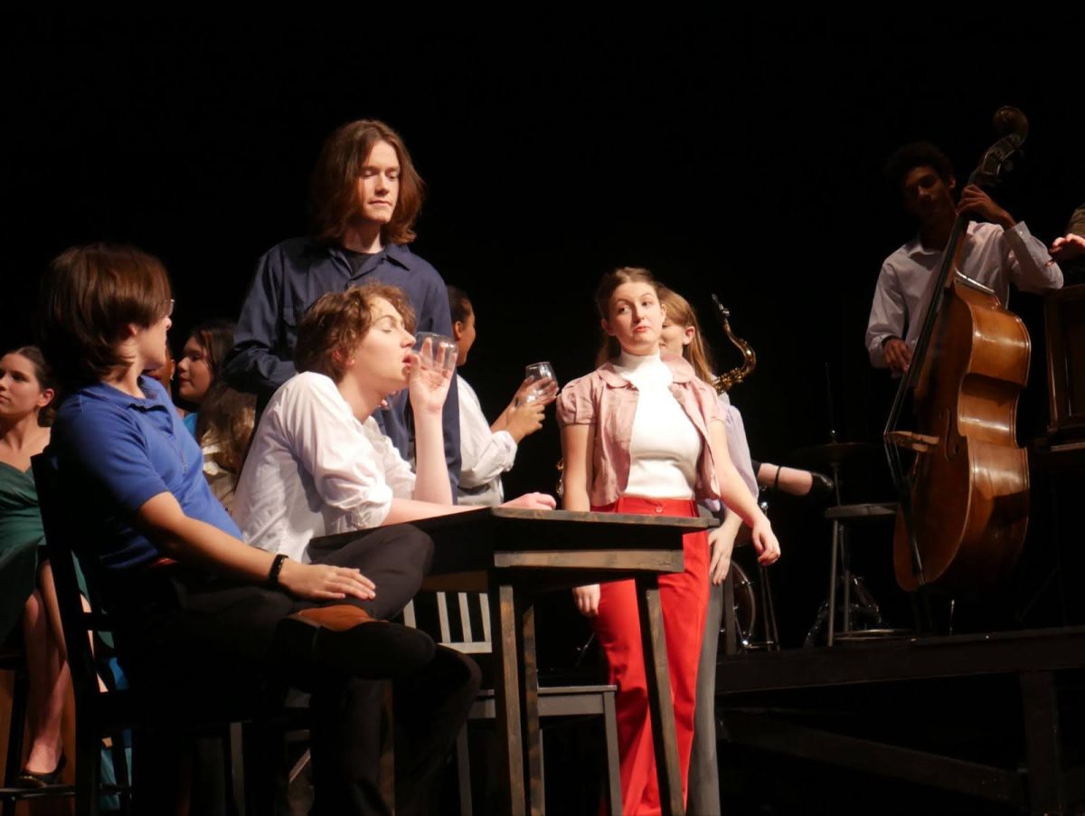 The Blackbird club patrons discuss the murder of Julius and Ethel Rosenburg. From left to right: 
Marc Solomon (played by Aidan Muldoon), Leo Berkovic (played by Christos Pethokoukis), Sam Brown (played by Davie Brown), Betty Fischer (played by Scarlett Adcock), and Rodery Carter (played by Zacharia Stover).