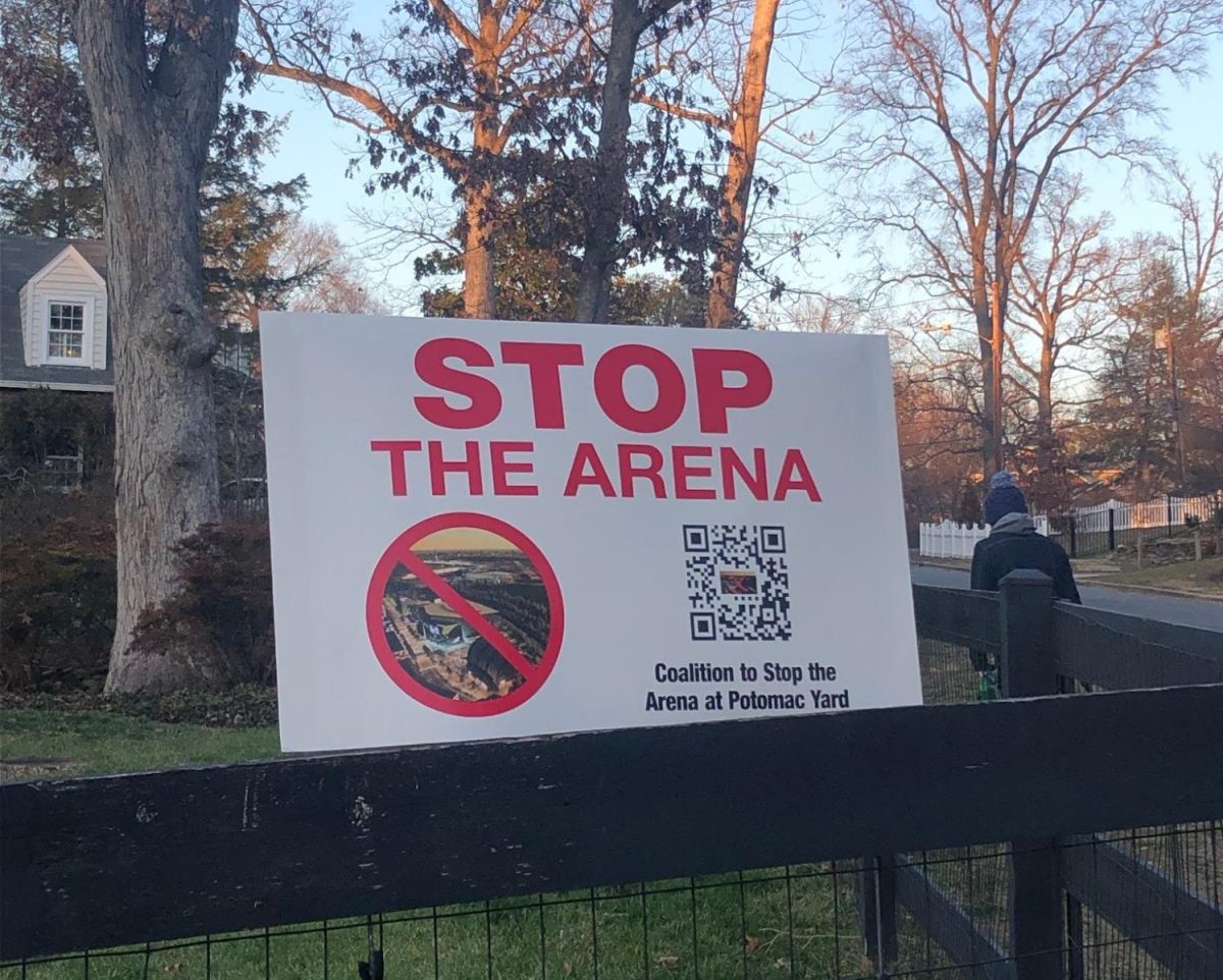 Sign protesting the new Capital One Arena sits on an Alexandria citizens fence. 