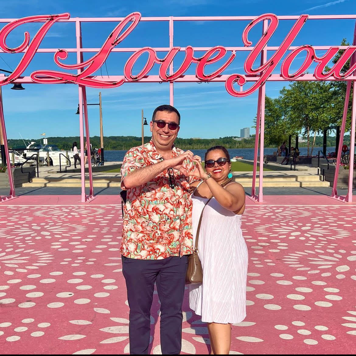Veronica Yale and husband Roburt Yale pose in front of Old Town’s “I Love You” sign. 