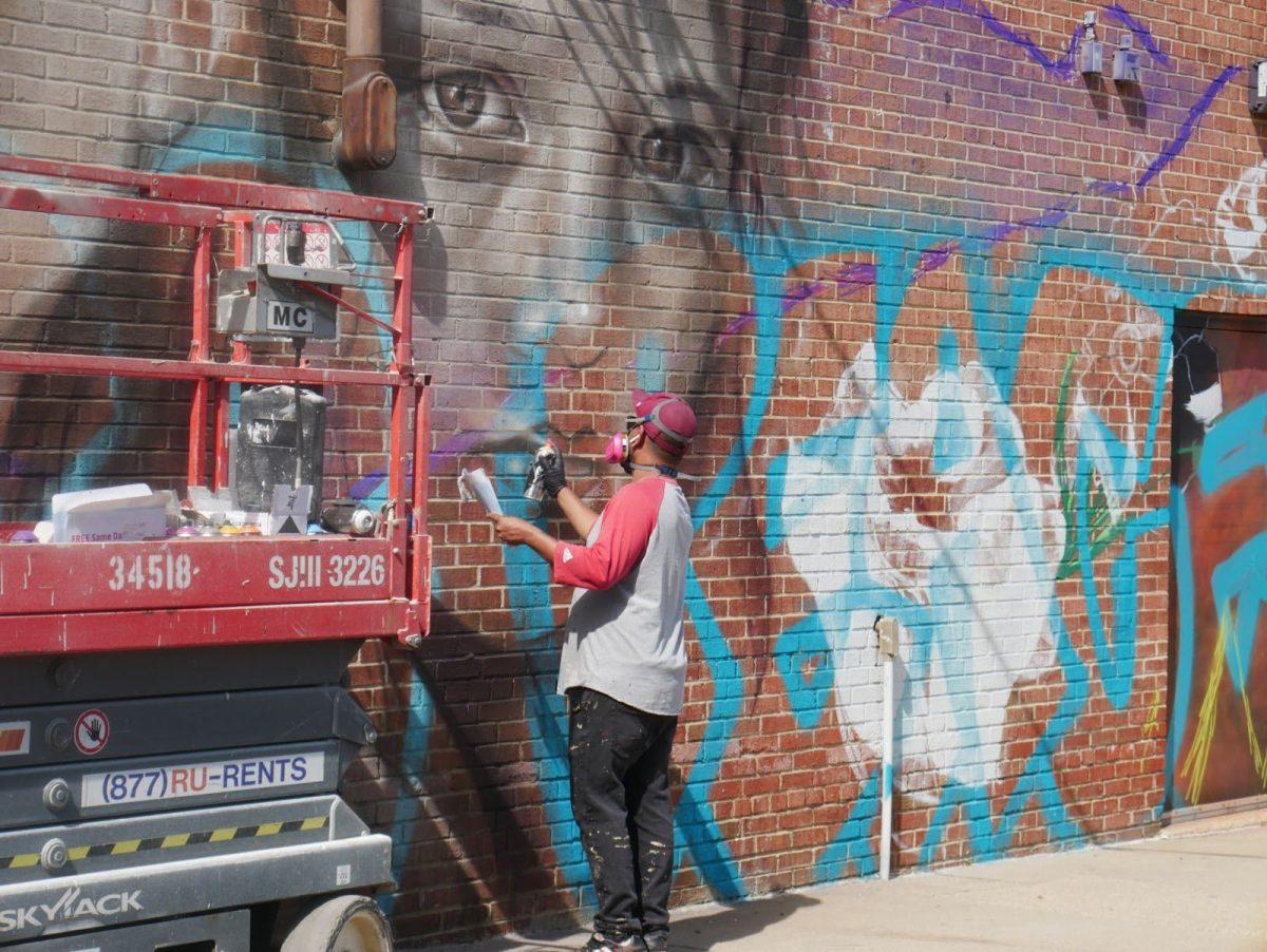 Roberto “Sef” Seminario works on the Bradlee mural. Located along King Street, Bradlee is a hub for ACHS students and the wider Alexandria community.