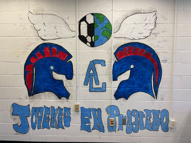 Mural painted and signed by Youngins in Progress members brightens up the ACHS hallway. / Ana Bonilla