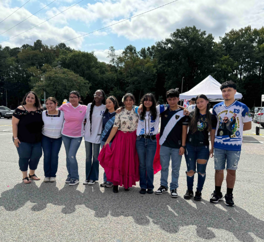 Latinos Unidos members pose for a group photo alongside the Latinos Unidos sponsor Carmen Canales. From left to right: Carmen Canales, Seychelle Shamir, Ximena Juarez Hernandez, Saida Idris, Fatima Perez, Jessica Reyes Morales, Evelyn Rivas, Alan Campos, Daisy Rivas, Christian Ramirez.
