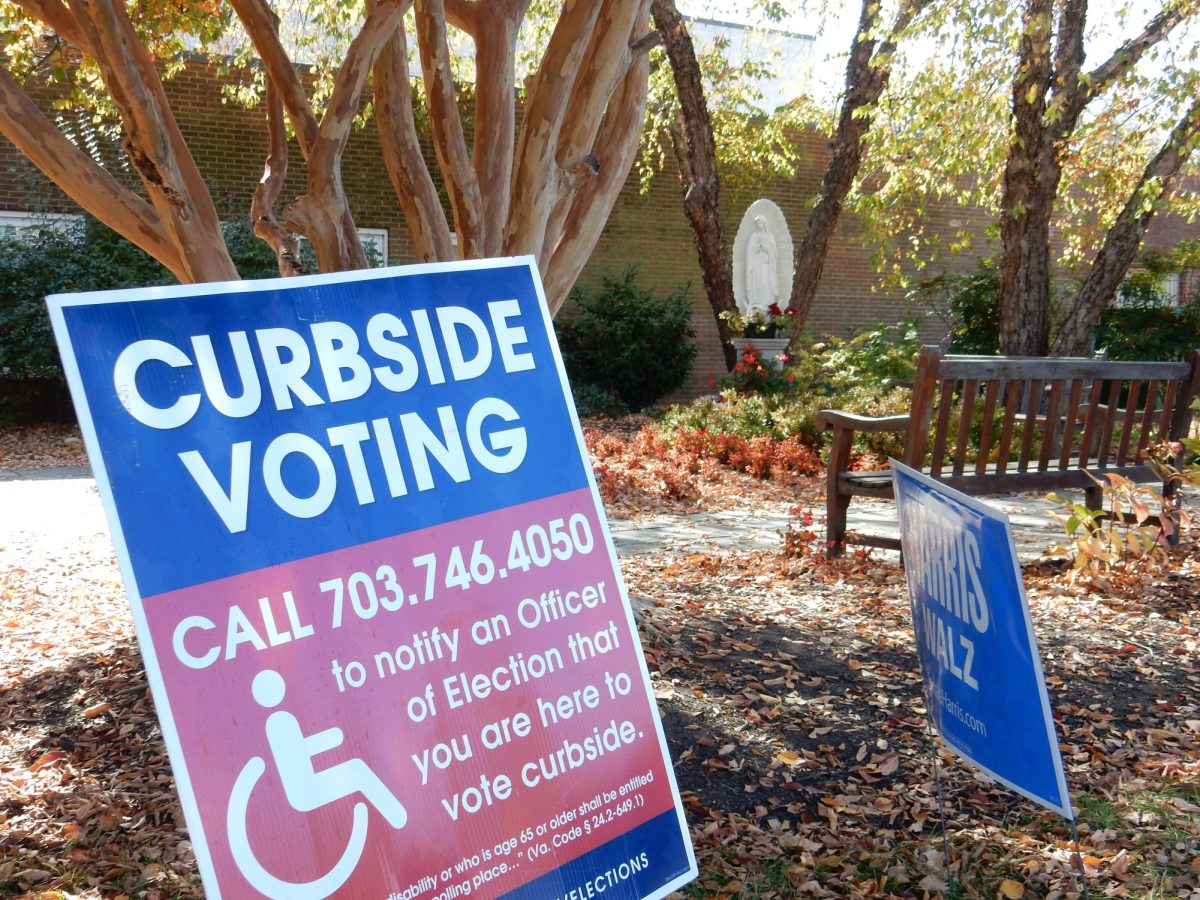 Statues and sculptures loom over voters at the Blessed Sacrament poll site.