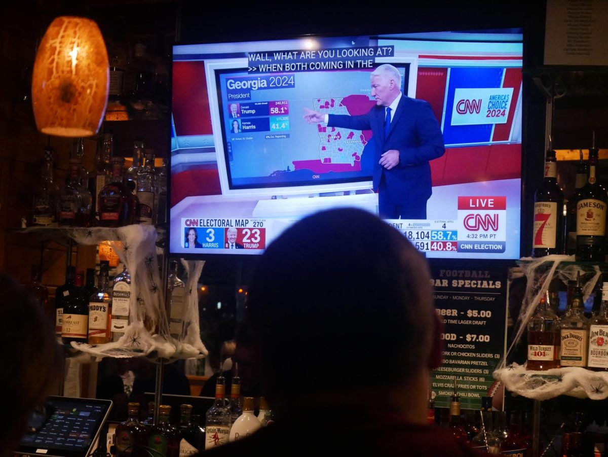 Democrats anxiously watch national election results come in at the Alexandria Democratic Committee's watch party in Del Ray.