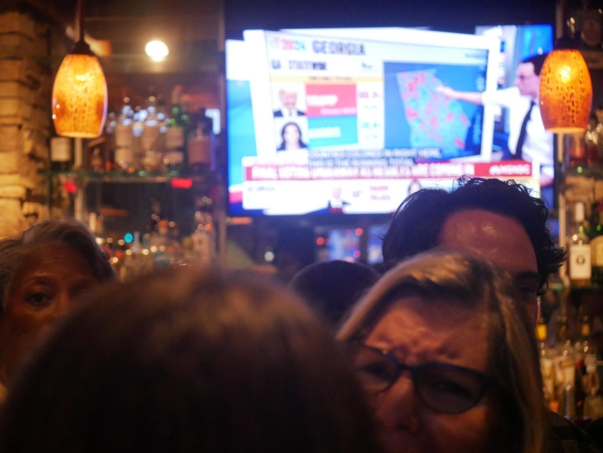 Democrats gather at Pork Barrel BBQ, a restaurant in Del Ray, to monitor election results.