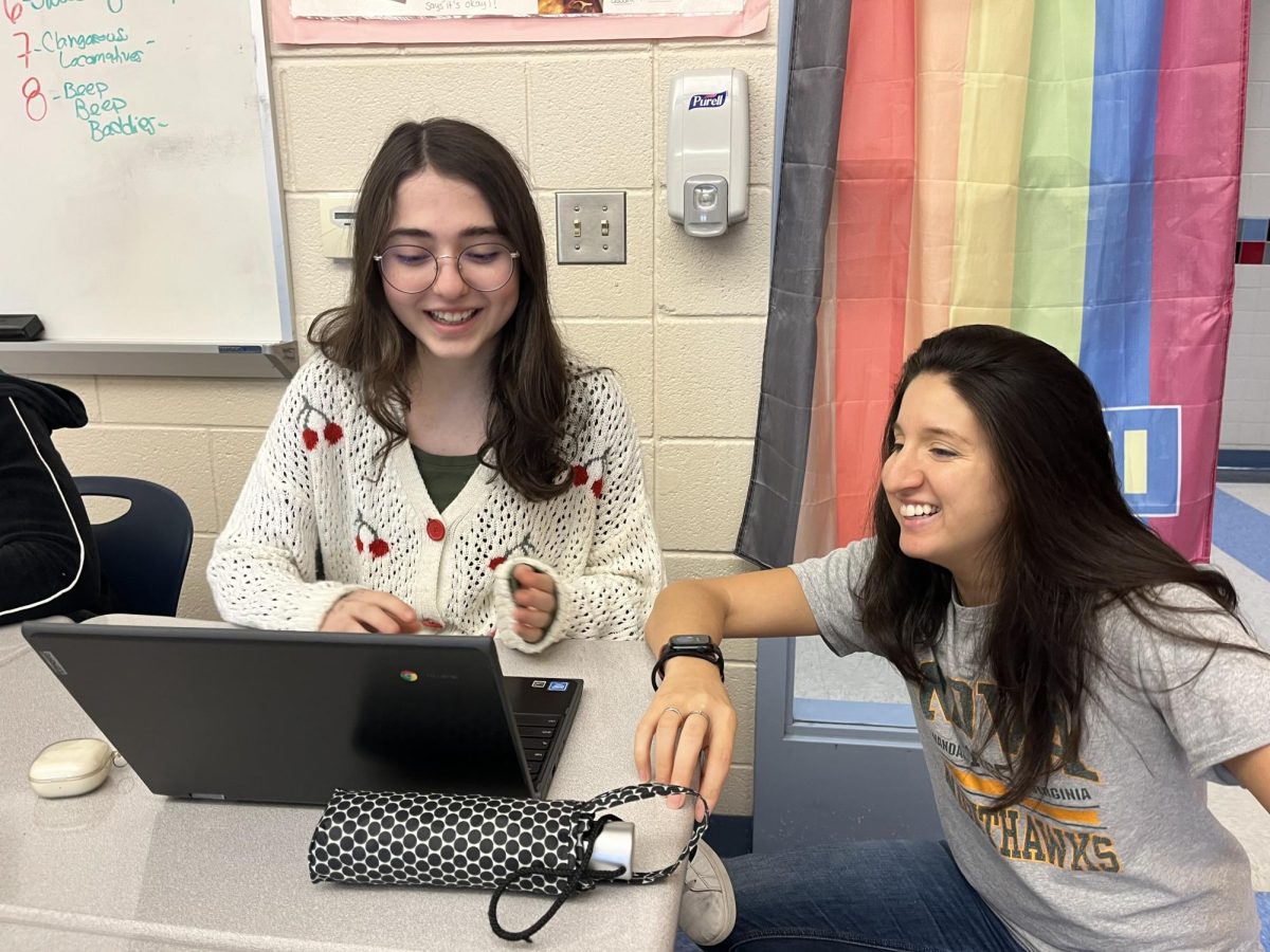 DE Composition student Simge Gerdaneri gets help from Bentley on her essay.