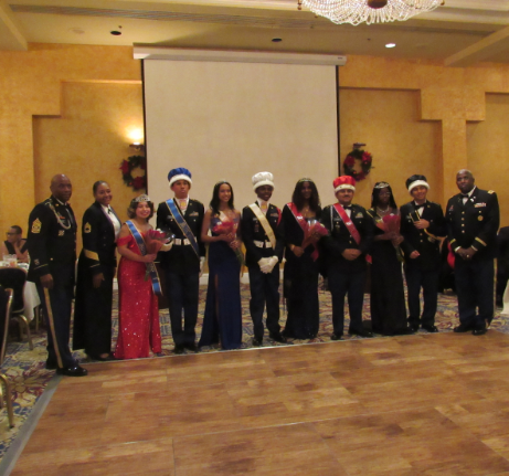 JROTC crowned this year's Royal Court during the event. Winners (from 3rd left to 3rd right): London Gomez (11th), Josue Delgado (11th), Nathania My-Love (10th), Stephen Nyamebekyere (10th), Lameis Abdelgawad (12th), Jefferson Alvarez (12th), Audrey Abbam (9th), Dennis Vasquez (9th) being celebrated alongside Command Sergeant Major William Jordan (left), Sergeant First Class Felisa Holden (2nd to left), and Colonel Reginald Geary (right).