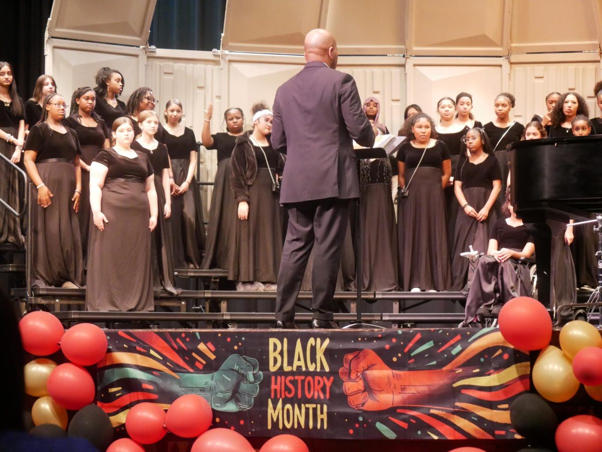 Shawn C. Thorpe conducts the Francis C. Hammond Middle School choir as it sings "This is Me" from "The Greatest Showman."