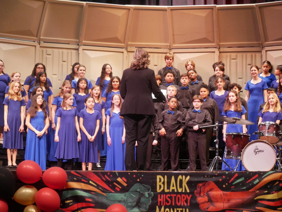 Jessica Sayler conducts the George Washington Middle School Combined Choir in its rendition of "Follow the Drinking Gourd."