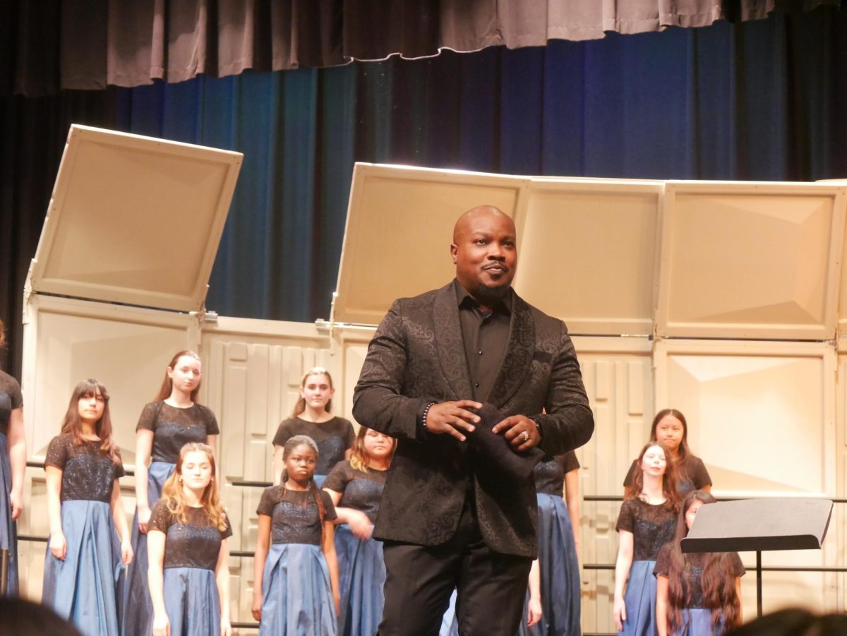 Theodore Thorpe III shares opening remarks before conducting the ACHS Concert and Mixed Combined choirs. "It was a great night," Thorpe said after the show. "Really great audience and I think all our choirs did well."