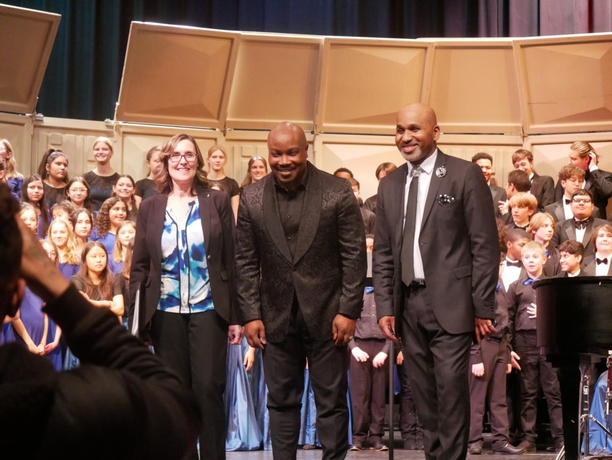 Conductors Jessica Sayler of George Washington Middle School, Shawn C. Thorpe of Francis C. Hammond Middle School and Theodore Thorpe III of ACHS pose for pictures after the finale.