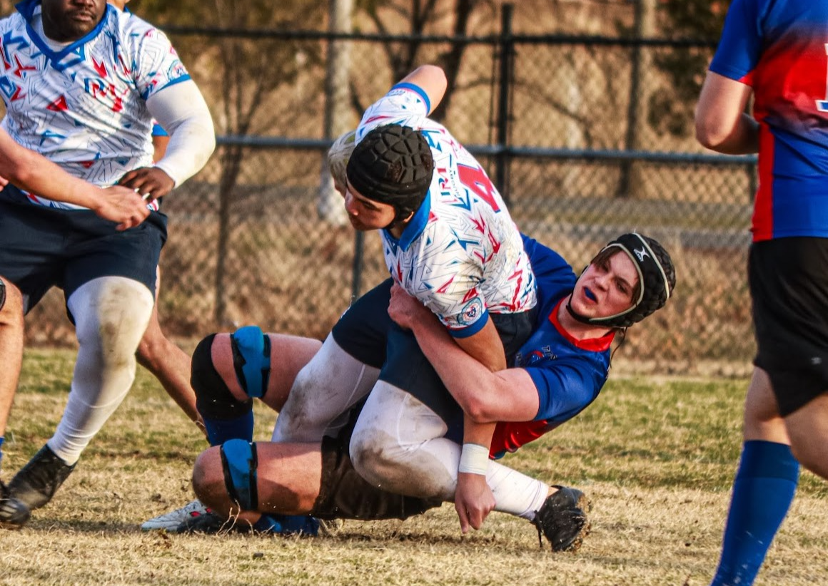 Seamus White performing a hip-drop tackle on the opponent. 
Photo from Milky Hailemichael
