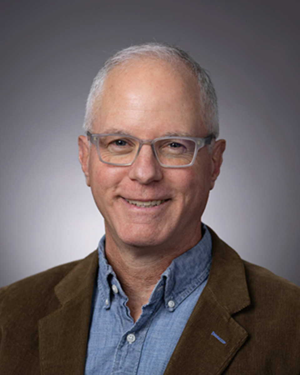 Ralph Espach smiles in his official staff photo.