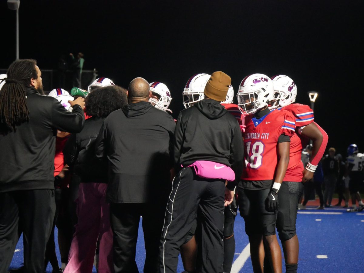 Titans take a time out to strategize with  coaches.