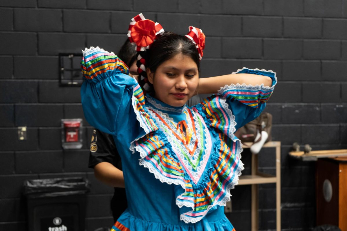 Mexican Folkloric dancer Jessica Reyes Morales prepares for her performance.