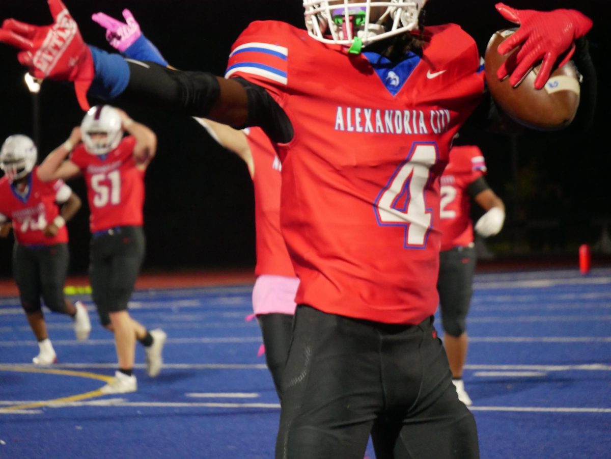 Senior Jamar Cannon, wide receiver,  holds possession of the ball during the third quarter. 
