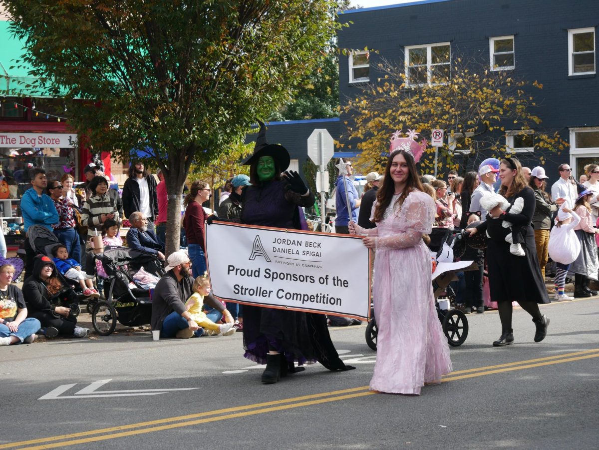The two sponsors of the Stroller Competition, Jordan Beck and Daniela Spigai, lead the strollers in the parade.