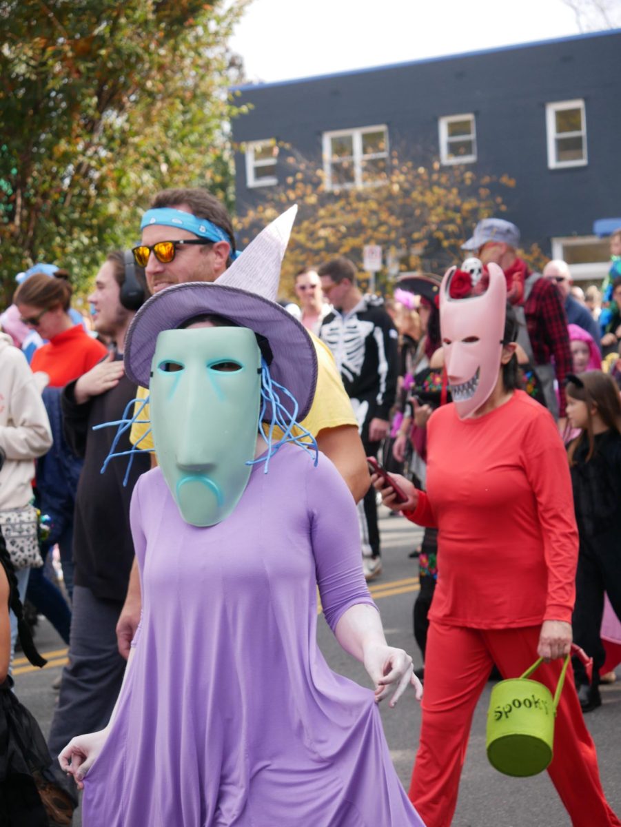 People dressed as the trick or treaters from Tim Burton's "The Nightmare Before Christmas" walk in the parade.