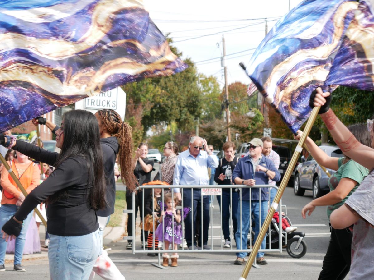 Alexandria City High School's Zombie Marching Band joins the parade.