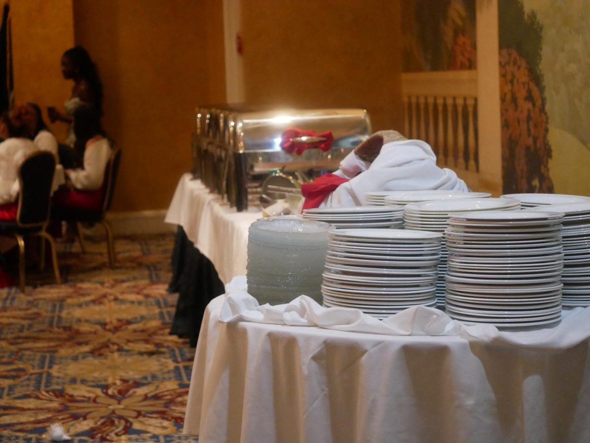 Following the toast, cadets begin the dinner portion of the evening, with a large table of food awaiting them. 