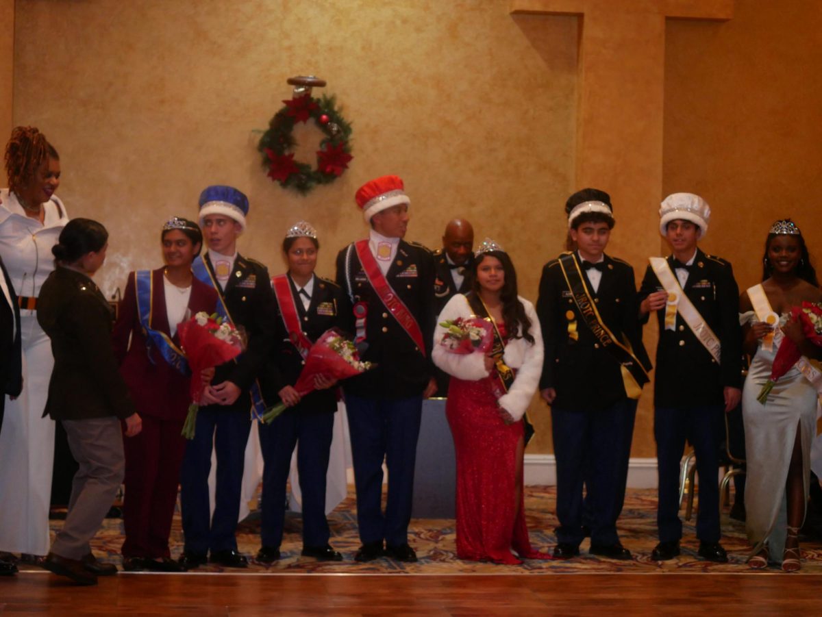 The Military Ball court poses after their crowning. Cadet Captain Josue Delgado (right middle) and Cadet First Lieutenant Kymberlyn Santos (left middle) win senior king and queen. Cadet First Lieutenant Thomas Cruz and Cadet First Lieutenant Ambika Varma (far left) win junior prince and princess. Cadet Second Lieutenant Audrey Abbam and Cadet Sergeant Giovanni Almanza (far right) win somphomore prince and princess. Cadet Private Ashley Adqui Ordonez and Cadet Private Anthony Aleman (center) win freshman prince and princess. 