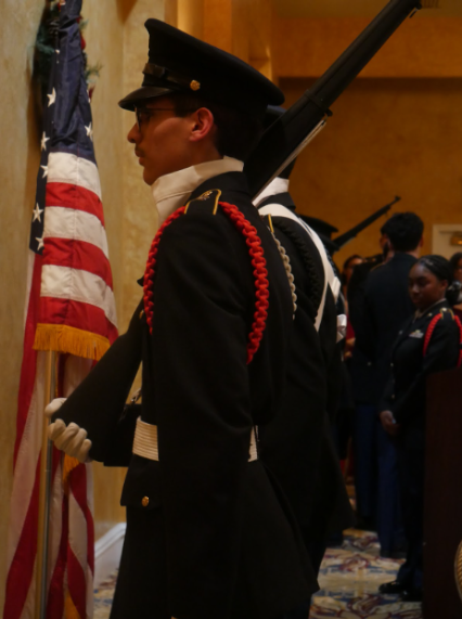 First Lieutenant Marco Montero stands at attention as he waits for the command to retire the colors to end the ceremony. This is followed by the ceremonial announcement of the winners of JROTC Queens and Kings.