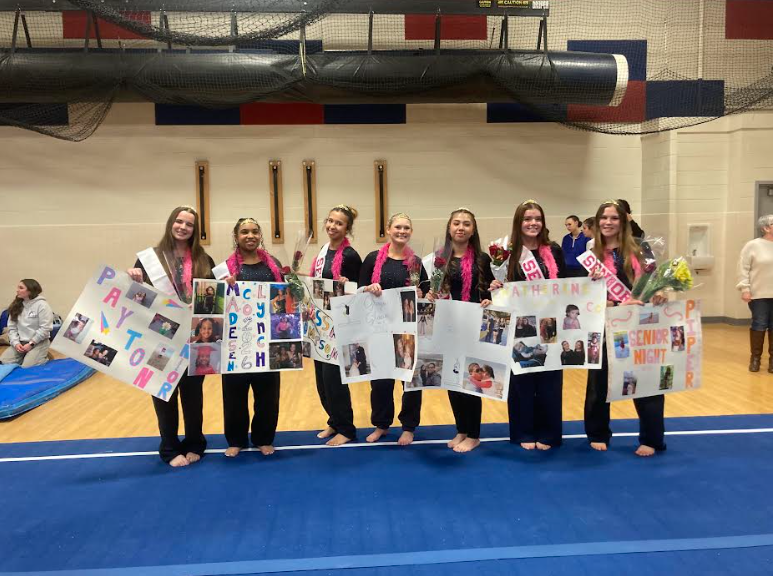 Titan gymnastics seniors celebrate Senior Night. From left: Payton Feehely, Madesen Lynch, Anessa Thompson, Grayson Glazier, Colomba Lara Cabanas, Katherine Connelly, Piper MacCubbin