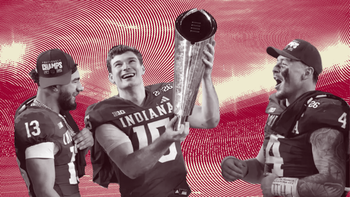 Indiana quarterback Fernando Mendoza holds the championship trophy after leading his team to victory in the 2026 College Football National Championship.