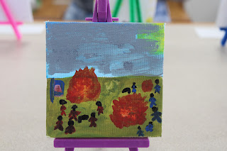 A canvas titled "The Starter" shows America's beginning. The artist, M. M. M. W., shares that "This artwork is about the American Revolutionary War. The British are fighting the American colonies. The British are red and American colonies, blue."