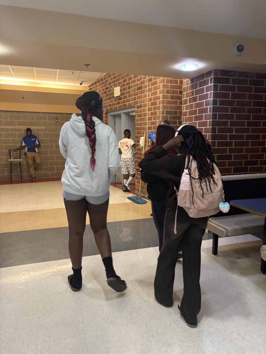 Students walk together out of the cafeteria after B Lunch.
