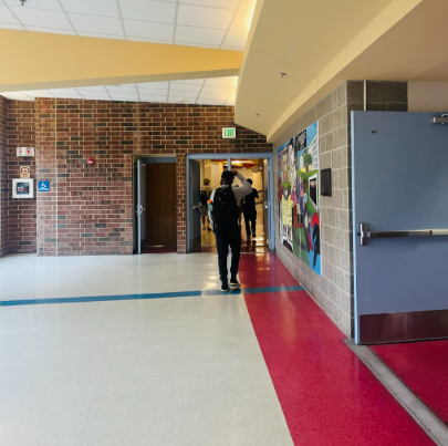 Students walking around the hallways in the King Street Campus.